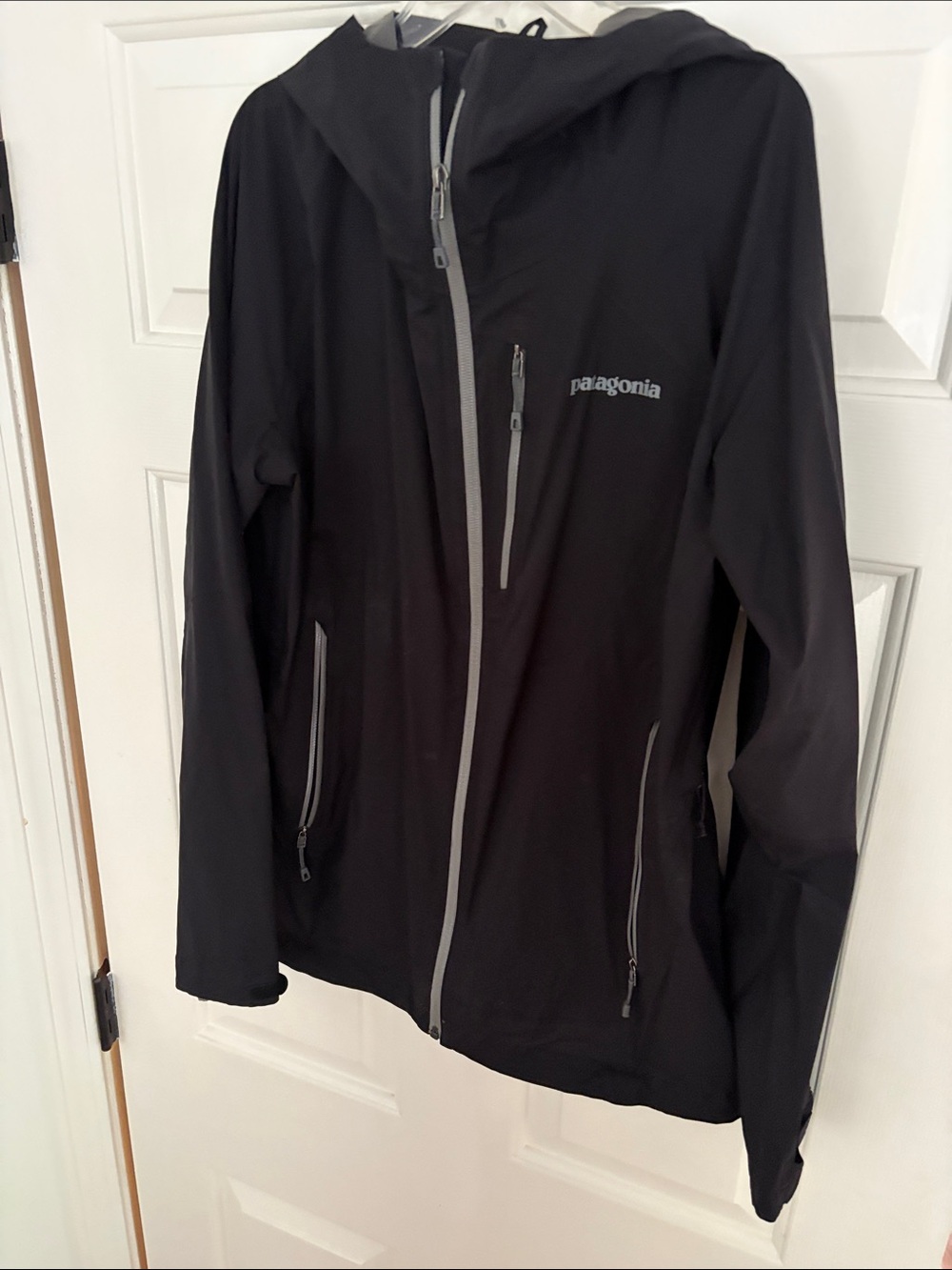 Patagonia Black Hooded Rain Jacket with gray Zippers
